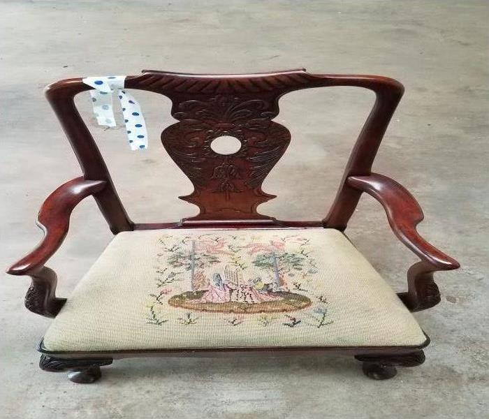 antique decorative arm chair with dirty seat