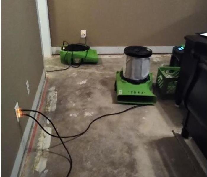 SERVPRO air movers evaporating water from a recent damage in a bedroom. 