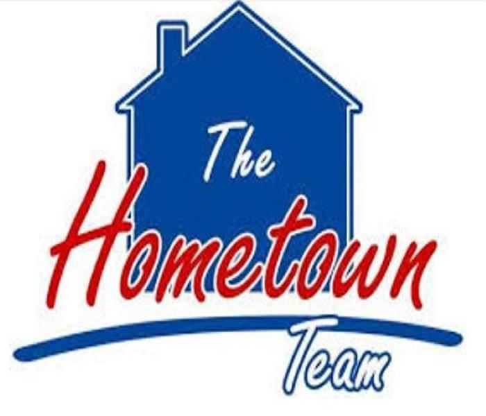 Home with "the home town team" written in front