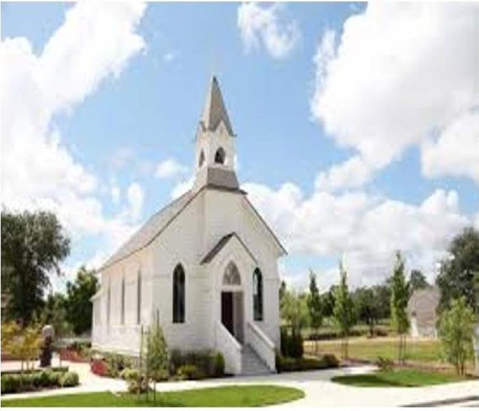 Traditional steeple church on beautiful garden grounds